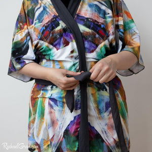 Artist Rachael Grad in black and white bathrobe tying knot