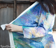 Load image into Gallery viewer, Artist Rachael Grad in purple yellow floral bathrobe side view