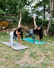 Load image into Gallery viewer, black and white yoga leggings by Canadian Artist Rachael Grad in lunging pose