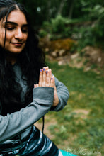 Load image into Gallery viewer, black and women's leggings by Canadian Artist Rachael Grad on women meditating