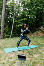 Load image into Gallery viewer, black and white women's yoga leggings by Canadian Artist Rachael Grad in squatting pose