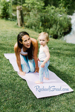 Load image into Gallery viewer, mom and me leggings teal striped set on mom and toddler by Canadian artist Rachael Grad on mom and daughter