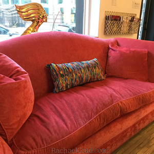 Fluid Long Pillowcase MultiColor 2 Bright on pink couch by artist Rachael Grad gold statue