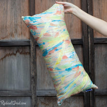 Load image into Gallery viewer, yellow pillow 24 x 12 by Toronto Artist Rachael Grad in hand front view