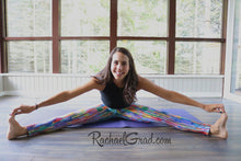 Load image into Gallery viewer, Striped Rainbow Yoga Leggings by Toronto Artist Rachael Grad in pilates studio