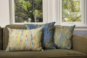 Pillow Group Spring Collection pillows on green couch by Artist Rachael Grad