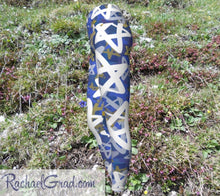 Load image into Gallery viewer, Stars Chanukah Leggings by Toronto Artist Rachael Grad grass background side view