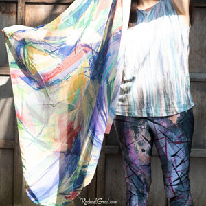 abstract art capri leggings on artist Rachael Grad holding scarf