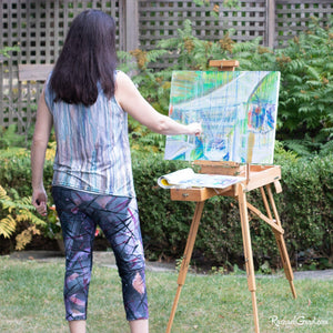 abstract art capri leggings on artist Rachael Grad painting back view