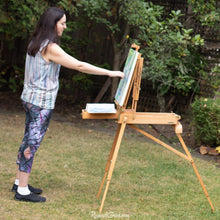 Load image into Gallery viewer, abstract art capri leggings on artist Rachael Grad painting side