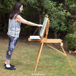abstract art capri leggings on artist Rachael Grad painting side
