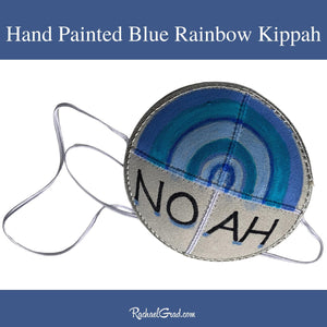 baby kippah with hand painted blue rainbow art by Canadian artist Rachael Grad