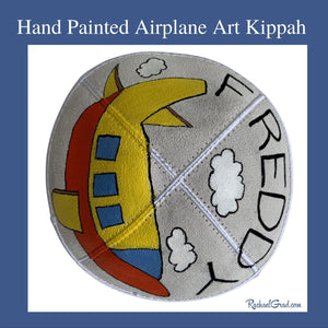 hand painted airplane art kippah by Toronto artist Rachael Grad for Freddy side view