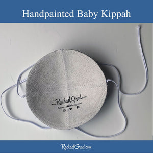 inside of baby kippah handpainted by Canadian artist Rachael Grad