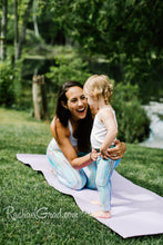 Load image into Gallery viewer, women&#39;s yoga leggings in teal stripes with Canadian artist Rachael Grad on mom and toddler