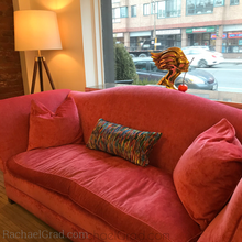 Load image into Gallery viewer, Fluid Long Pillowcase MultiColor 2 Bright on pink couch by artist Rachael Grad lamp and statue